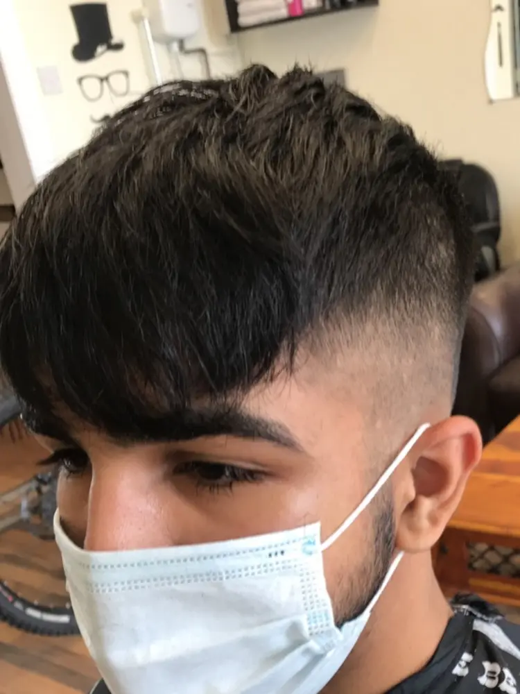 Quiff with a high fade